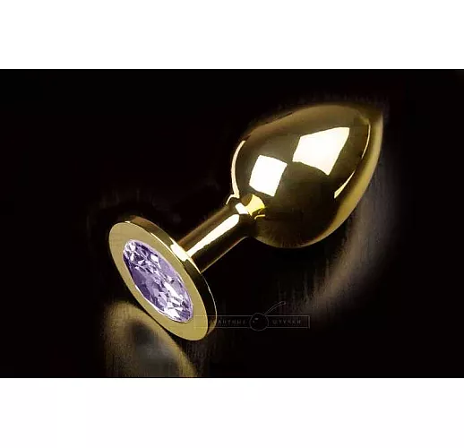 Большая золотая анальная пробка с закругленным кончиком и сиреневым кристаллом - 9 см.