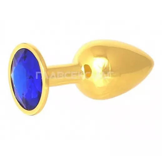 Золотистая анальная пробка с синим кристаллом - 7 см. Золотистая анальная пробка с синим кристаллом - 7 см.