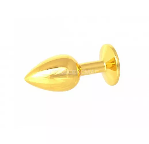 Золотистая анальная пробка с зелёным кристаллом - 7 см. Золотистая анальная пробка с зелёным кристаллом - 7 см.