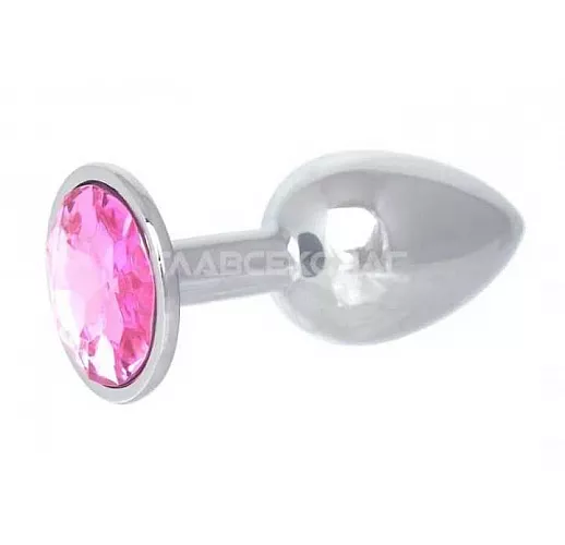 Серебристая анальная втулка с розовым кристаллом в основании - 7 см. Серебристая анальная втулка с розовым кристаллом в основании - 7 см.