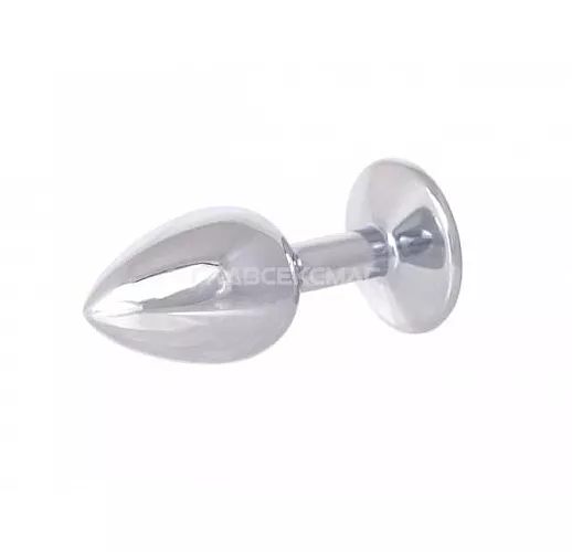 Серебристая анальная втулка с розовым кристаллом в основании - 7 см. Серебристая анальная втулка с розовым кристаллом в основании - 7 см.