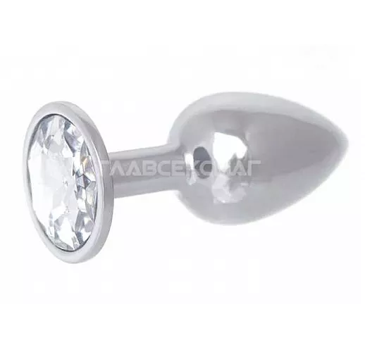 Серебристая анальная втулка с прозрачным кристаллом в основании - 7 см. Серебристая анальная втулка с прозрачным кристаллом в основании - 7 см.